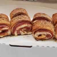 Stromboli
 · Our homemade dough wrapped in a layer of Pepperoni, Ham, Salami & Provolone Cheese. Baked to...