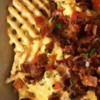 Irish Nachos
 · Waffle potatoes, bacon, beer cheese, and pico de gallo.