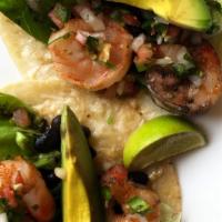Shrimp Tacos
 · 3 shrimp tacos with blackened shrimp, corn tortillas, black beans, pico de gallo,  lettuce, ...