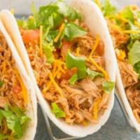 Chicken Tacos
 · Contains peanuts. 3 tacos. Corn tortillas, marinated in dry chiles, grilled chicken thighs, ...