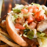 The Chief
 · Chopped chicken breast and smoked bacon, Provolone, sauteed onions, green peppers, cayenne, ...
