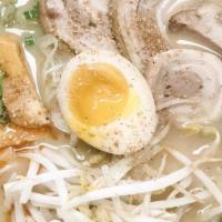 (A). Tonkotsu Ramen · Pork belly roll, leeks, green onion, egg, bamboo shoots (menu), bean sprouts, sesame seed po...
