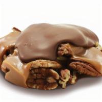 Milk Chocolate Pecan Snapper · Our Milk Chocolate Pecan Snapper features mammoth pecan halves in a pool of hand-crafted cop...