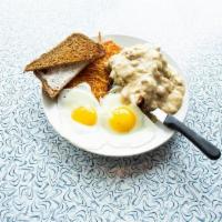 Chicken Fried Chicken · Golden fried chicken breast smothered in country gravy with 2 eggs any style, hashbrowns and...