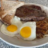 Steak And Eggs · Sirloin steak grilled to perfection, two fresh eggs any style served with hash browns.