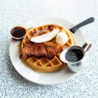 Chicken And Waffles · Golden fried chicken breast set atop one of our house-made waffles, served with a warm side ...