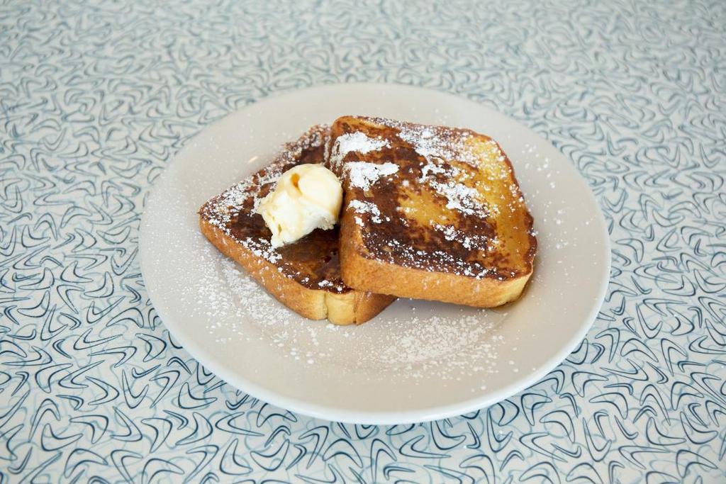 Fabulous French Toast · Thick slices of battered egg bread grilled to golden brown and dusted with powdered sugar.