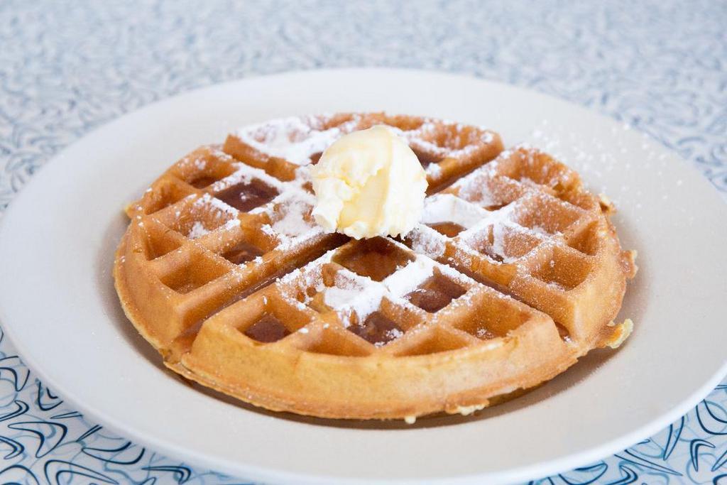 Wonderful Waffle · Thick golden brown Belgian waffle with warm maple syrup and whipped cream