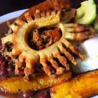 Bandeja Paisa · Traditional Colombian dish: Colombian chorizo, pork rinds, shredded beef served with colombi...
