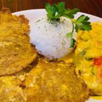 Coconut Lime Chicken · Tender Chicken breast in a coconut lime sauce served with rice and sweet plantains.