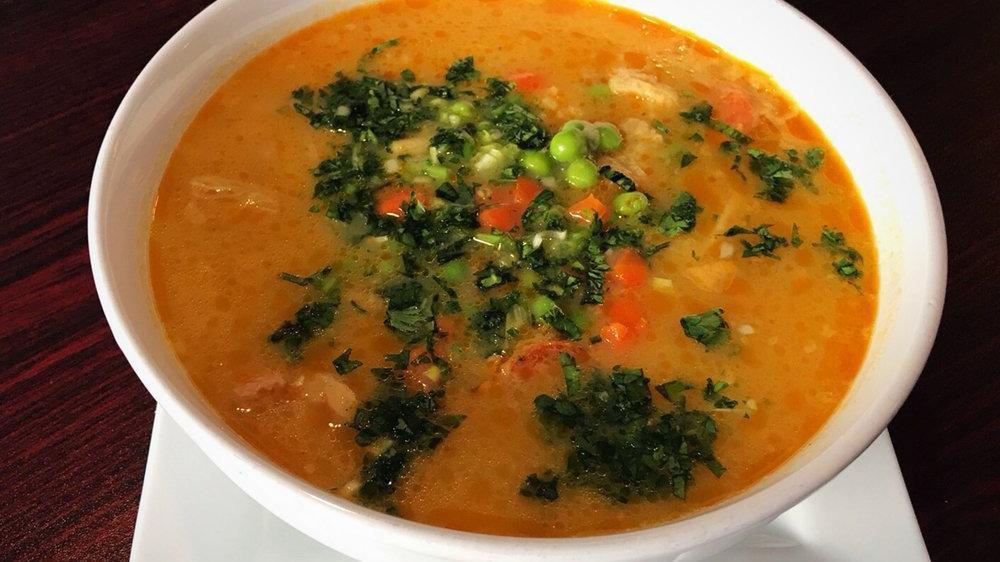 Mondongo · Soup made with pork, tripe, chorizo, potatoes, peas, and carrots. Served with rice & avocado.
Gluten-free.