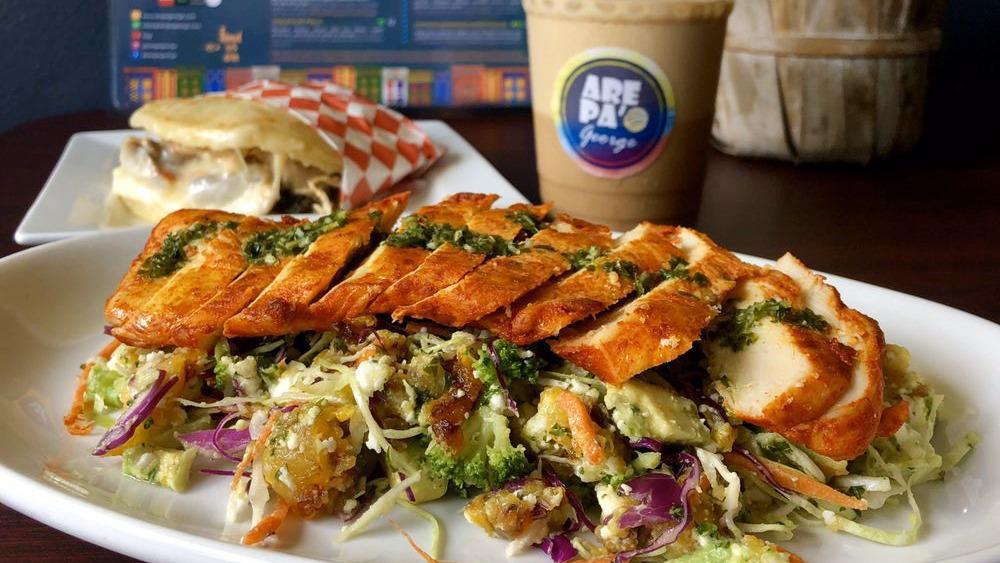 Chicken Salad · Shredded cabbage, shredded carrots, broccoli, avocado, sweet plantains, feta cheese, and chimichurri sauce and sliced grilled chicken breast.