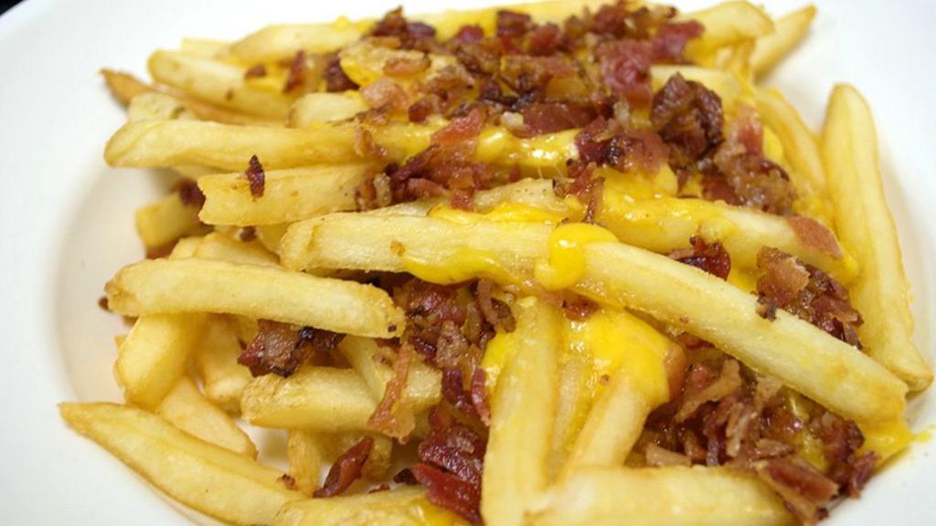 Loaded Fries · Fries topped with shredded cheddar cheese and hickory smoked bacon. Served with Boom-a-rang Ranch