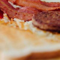 Elvin’S Ultimate Breakfast · 3 eggs, 3 slices of bacon and 2 sausage patties, hash browns, toast, or biscuit and gravy.