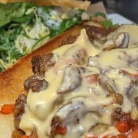 Philly Cheese Steak · grilled steak, onions & peppers, house cheese sauce