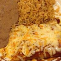 Enchilada · Soft corn tortillas stuffed with choice of filling, topped with baked cheese and your choice...