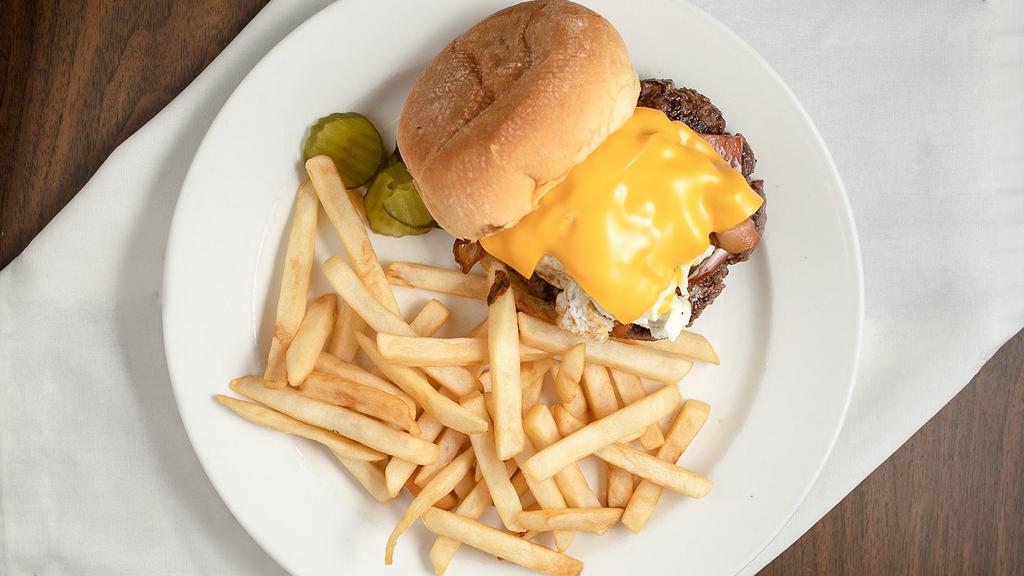 The Ultimate Burger · Grilled ham, crisp bacon, sausage patty, egg and cheese served with brown gravy and fries.