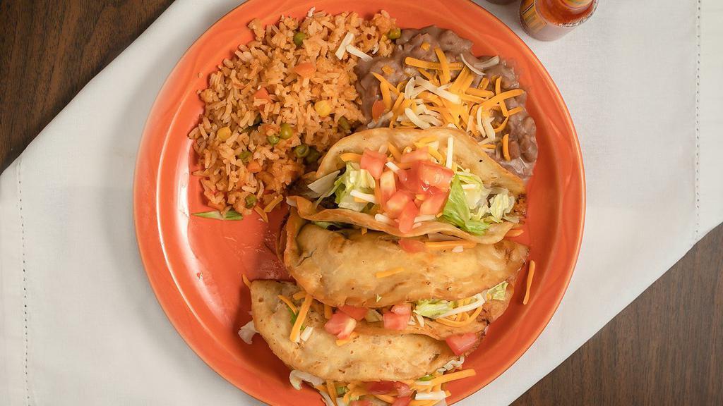 Hard Shell Tacos · Chicken, shredded beef, ground beef. Served with rice and beans.