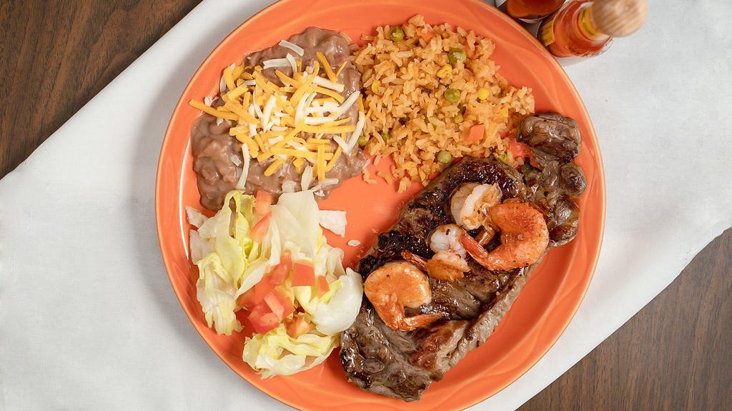Steak With Shrimp · Served with rice and beans.