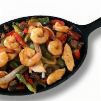 Mixed Fajitas · Beef, chicken, and shrimp. Served with rice and beans.