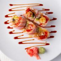 Pink Lady Roll (10) · spicy tuna, avocado, eel and shrimp tempura rolled in pink soybean paper, topped with eel sa...