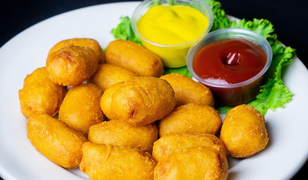 Mini Corn Dogs · Mini corn dogs double dipped and fried golden and crispy.