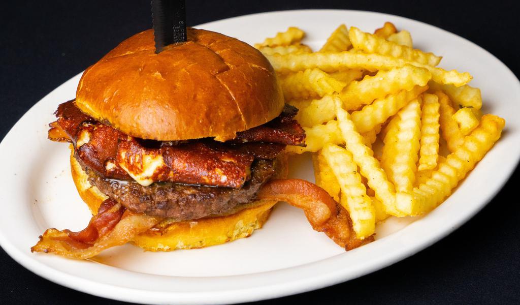 State Fair Burger · Wisconsin white cheddar cheese curds melted atop an expertly seasoned and grilled wagyu beef patty. Finished with crispy applewood smoked bacon and served on a soft brioche bun. Served with french fries or tator tots