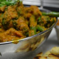 Veggie Tikka Masala Curry · Broccoli, mushrooms and green beans in our tikka masala curry sauce over saffron basmati ric...