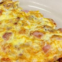Meat-Lovers Omelette · Our fluffy omelette featuring bacon, sausage, ham, & cheddar cheese.