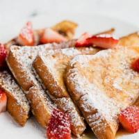 Strawberry French Toast · 4 buttery wedges of French toast filled with strawberries.