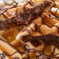 Nutella Waffles · 2 golden waffles filled with nutella.
