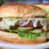 Garden Burger · Grilled veggie burger, toasted brioche, lettuce, tomato, onion, chipotle aioli, choice of ch...