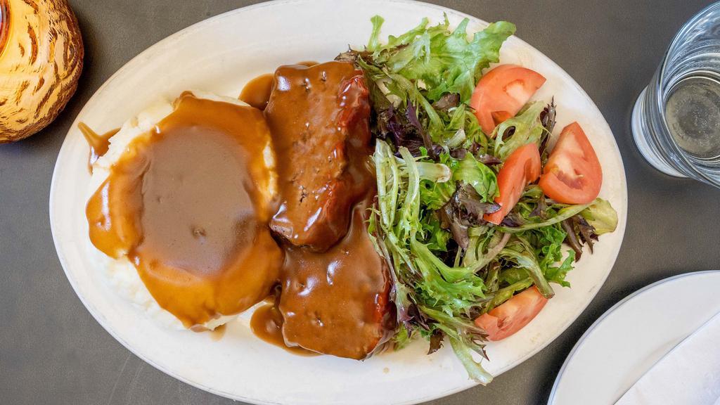 Mom'S Meatloaf Dinner · 2 thick cut pieces of homemade meatloaf, mashed potatoes, gravy and house salad.