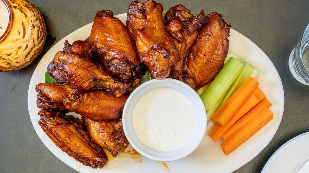 Holiday Wings · 12 Beer brined all natural jumbo wings tossed in your choice of one sauce, side of blue cheese or ranch, carrots and celery.