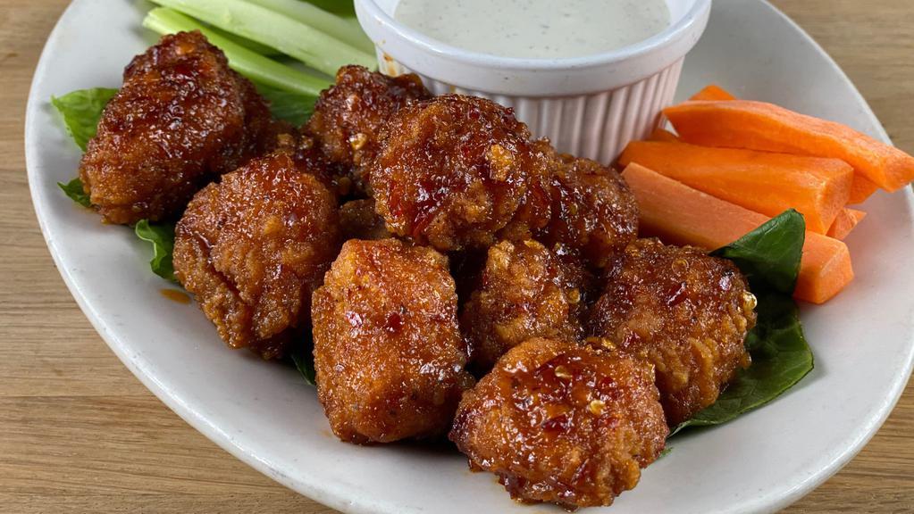 Boneless Wings · 10 Breaded all natural white meat chicken tossed in your choice of one sauce, side of blue cheese or ranch, carrots and celery.
