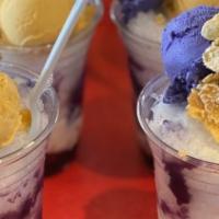Halo Halo · Shaved ice with sweetened fruits, evaporated milk and ice cream.