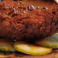 Southern Fried Chicken Sandwich · Buttermilk battered chicken breast, with Spicy Sweet Pickles, Hot Sauce and Honey.