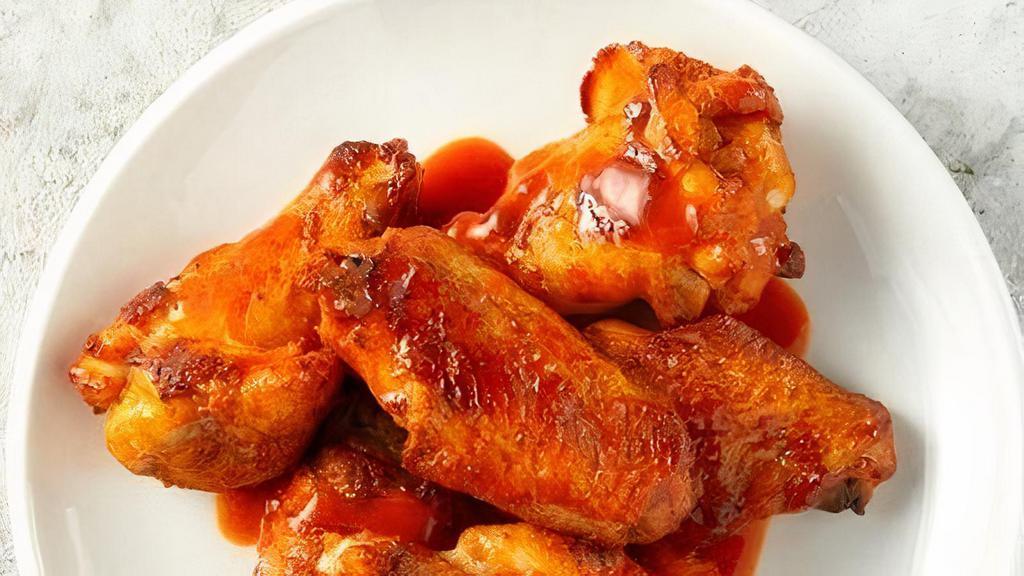 Chicken Wings · Crispy chicken wings, hand-spun in your choice of sauce or seasoning..