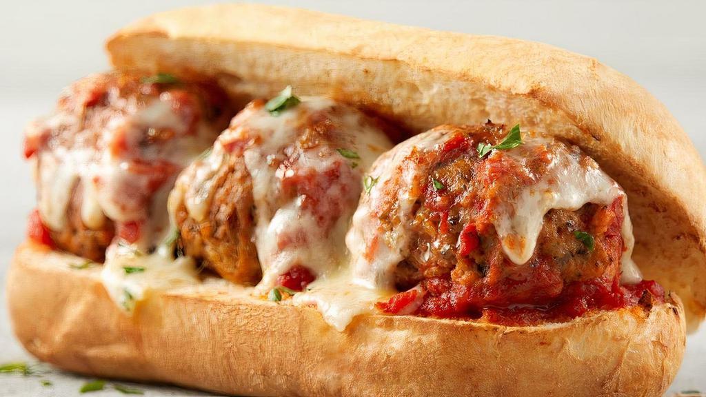 Meatball Sub · Meatballs tossed in hot pasta sauce placed in a soft sub roll, topped with freshly shredded 100% whole milk mozzarella and a sprinkle of Romano cheese, baked to perfection. .