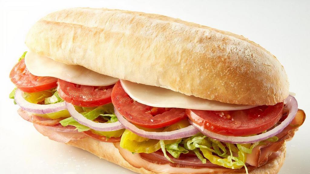 Italian Stallion Sub · Capicola, salami, and ham baked on a sub roll topped with provolone, Roma tomatoes, red onions, lettuce, banana peppers, and Italian dressing. .