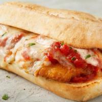Chicken Parmesan Sub · Deliciously baked chicken breast served on a sub roll topped with pasta sauce, freshly shred...