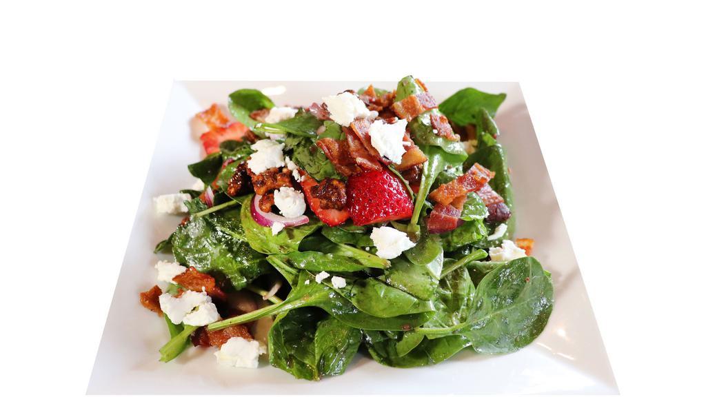 Spinach Salad · Mixed Greens, Red onions, Strawberries, Bacon, Goat Cheese, Walnuts, House-made Vinaigrette.