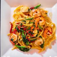 Seafood Fettuccine · Shrimp and scallops, sautéed broccoli rabe and sun dried tomatoes, white wine and butter.