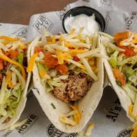 Carnitas Tacos · 3 flour tortillas, chicken, pork, or brisket with shredded lettuce, pico, and mixed cheese. ...