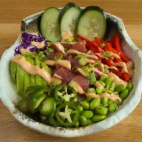 Vocano Ahi Poke Bowl · Sushi grade ahi tuna* marinated in a lemongrass soy ginger glaze, avocado, bell peppers, cuc...