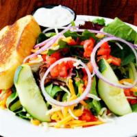 House Salad · Mixed greens, tomato, cucumber, red onion, shredded cheese, and choice of dressing