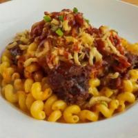Brisket Mac & Cheese · Cavatappi noodles with jalapeño bacon, jalapeños, American & cheddar cheese topped with bris...