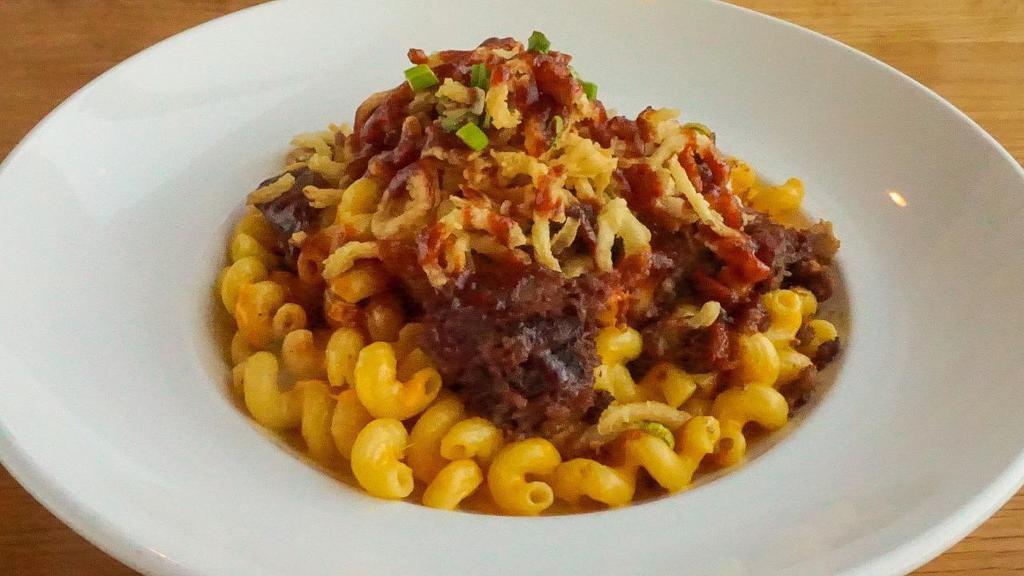 Brisket Mac & Cheese · Cavatappi noodles with jalapeño bacon, jalapeños, American & cheddar cheese topped with brisket, crispy onions and bbq sauce