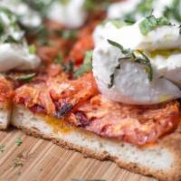 Dragona  · Baked with tomatoes and olive oil, then taken out of the oven and topped with burrata and fr...