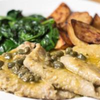 Veal Scaloppini Limone · Veal cutlets in a lemon and caper sauce with spinach and potatoes.